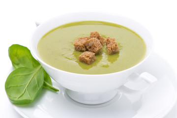 bowl of traditional spinach soup with croutons, close-up