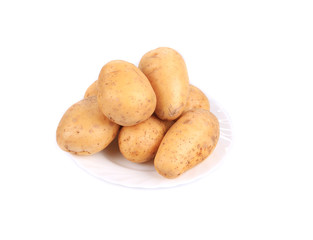 Ripe potatoes on the plate.