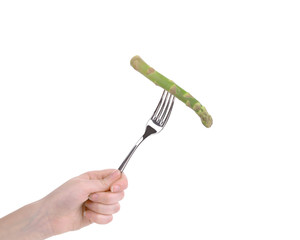 Green fresh asparagus on fork.