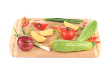 Fresh vegetables on cutting board.