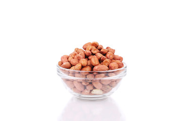 Glass bowl full with peanuts.