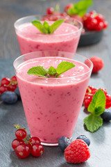 milkshake with fresh berries in a glass