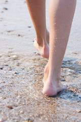 woman walking on the sand beach