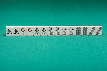 Smooth table surface with a mahjong on it