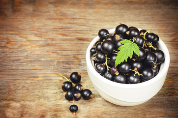 black currants in the white bowl
