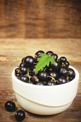 black currants in the white bowl