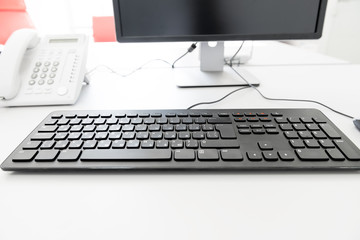 black keyboard on the desk in the office manager
