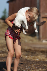 Plays a girl and with a cat