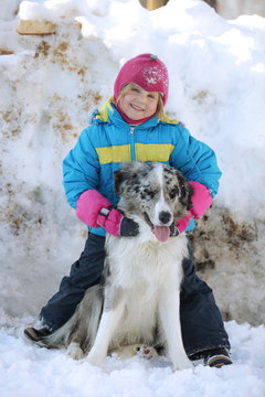 Girl playing with a Border Collie