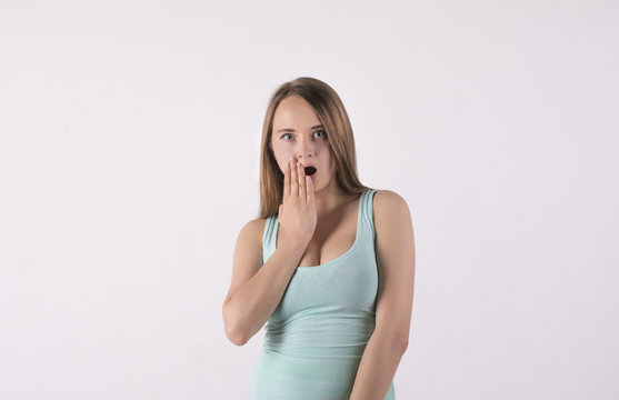 shocked and frightened young woman