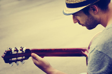 Man plays the guitar