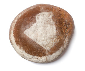 A loaf of fresh bread covered with rye flour in the shape of Alg