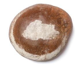 A loaf of fresh bread covered with rye flour in the shape of Bhu