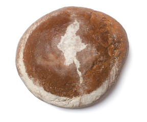A loaf of fresh bread covered with rye flour in the shape of Bur