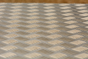 Pattern on metal seating panel