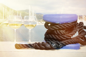 Pair of wineglasses against yachts in La Spezia, Italy