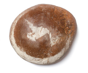 A loaf of fresh bread covered with rye flour in the shape of New