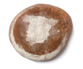 A loaf of fresh bread covered with rye flour in the shape of Spa