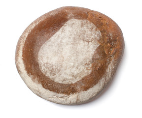 A loaf of fresh bread covered with rye flour in the shape of Nau