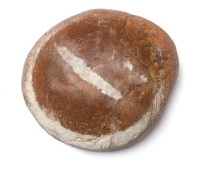 A loaf of fresh bread covered with rye flour in the shape of New