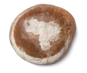A loaf of fresh bread covered with rye flour in the shape of Ven