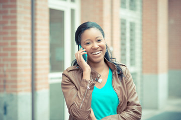 beautiful african young woman using smartphone