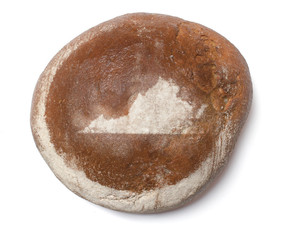 A loaf of fresh bread covered with rye flour in the shape of Vir
