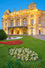 Obraz premium Facade of Slowackiego Theater at night in Krakow, Poland