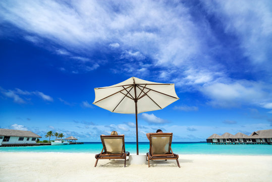 Couple on a tropical beach at Maldives © gawriloff