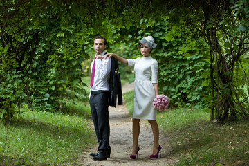 Fototapeta premium Wedding. Bride and groom in the garden on a summer evening.