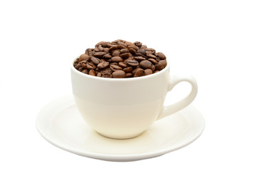 cup with coffee beans on a saucer