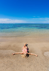 Woman relaxing on tropical beach