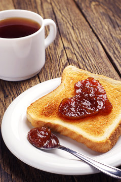 Toast bread with jam and cup of tea