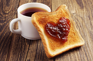 Cup of tea and toast bread with jam - obrazy, fototapety, plakaty