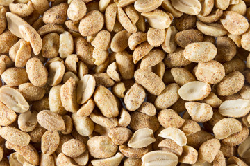 Dry roasted peanuts. scattered to make background or texture. Ma