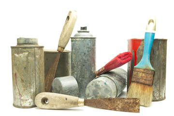 Old used spray cans and paint bucket