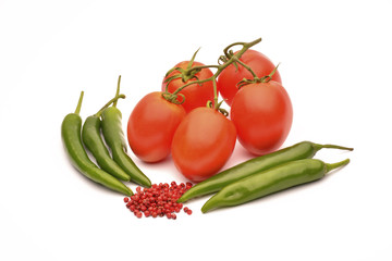 Tomatoes, chilli and pepper on white background