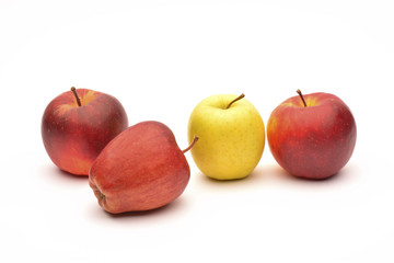 Fototapeta na wymiar Yellow and red apples on white background