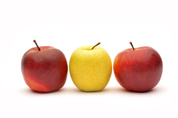 Yellow and red apples on white background