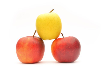 Yellow and red apples on white background