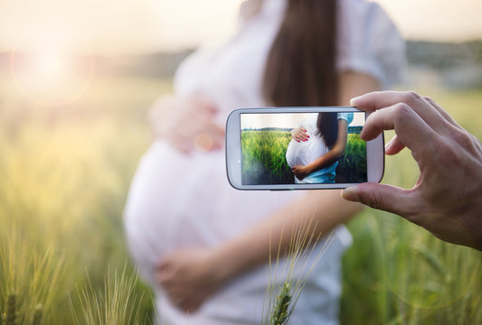 Taking picture of pregnant woman