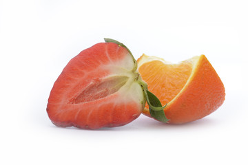 Strawberries and tangerine isolated on white background