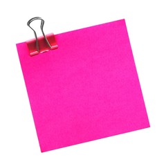 Blank pink post it note with paper clip isolated on white
