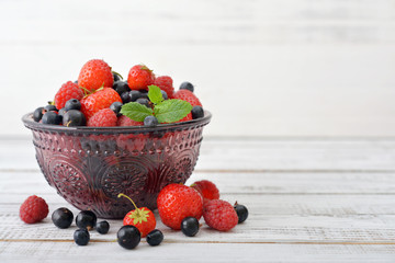 Berries in glass vase
