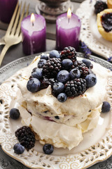 Pavlova cake with blueberries and blackberries