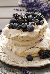 Pavlova cake with blueberries and blackberries