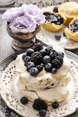 Pavlova cake with blueberries and blackberries