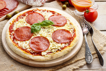Italian cuisine: pizza with salami
