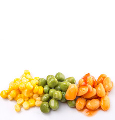 A group of baked beans, green peas and sweet corn over white 
