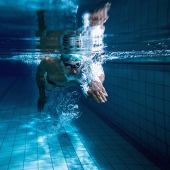 Fit swimmer training by himself